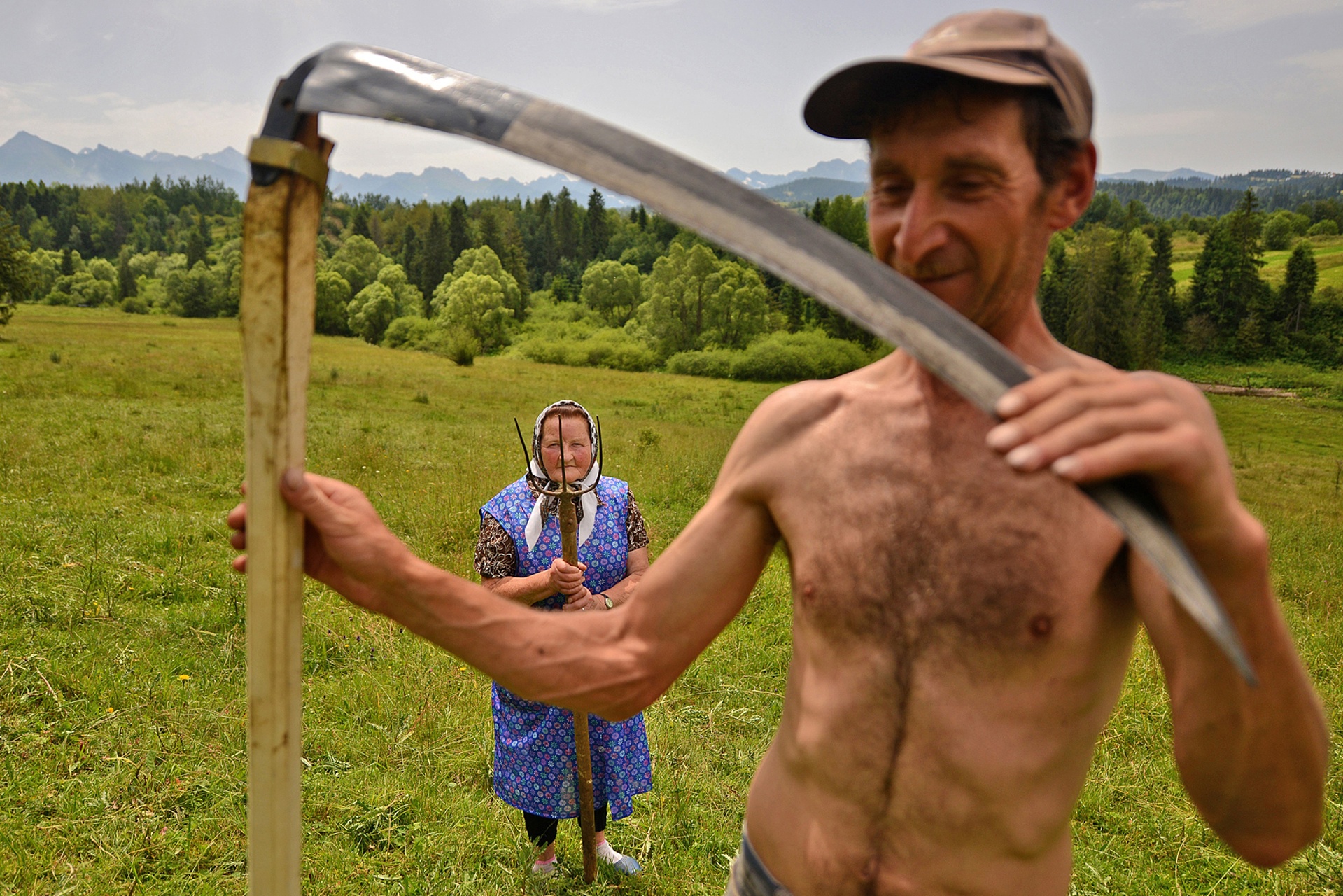 Traditional haymaking in Poland, where many people continue to use the scythe and pitchfork (Bartlomiej Jurecki)
