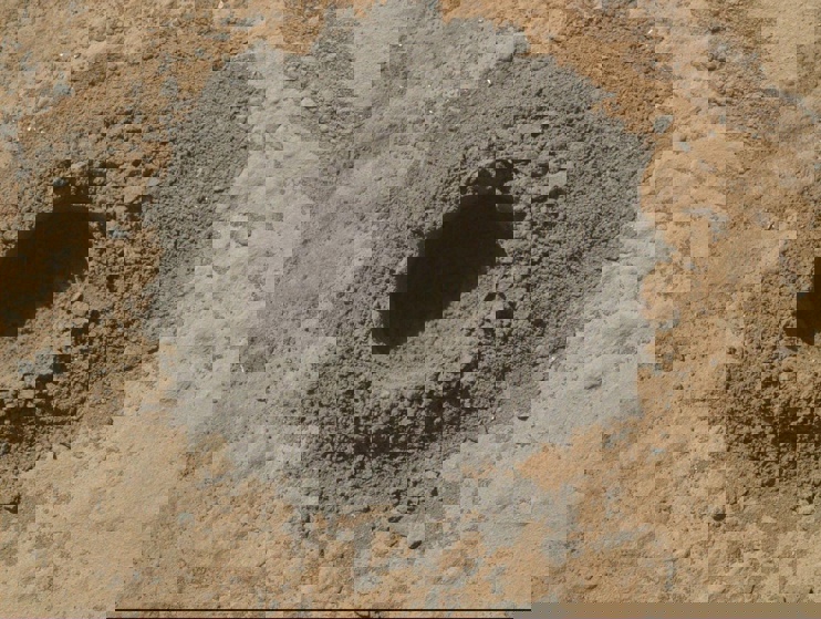 A drill hole left by the Curiosity rover, while collecting soil samples in April of 2014.