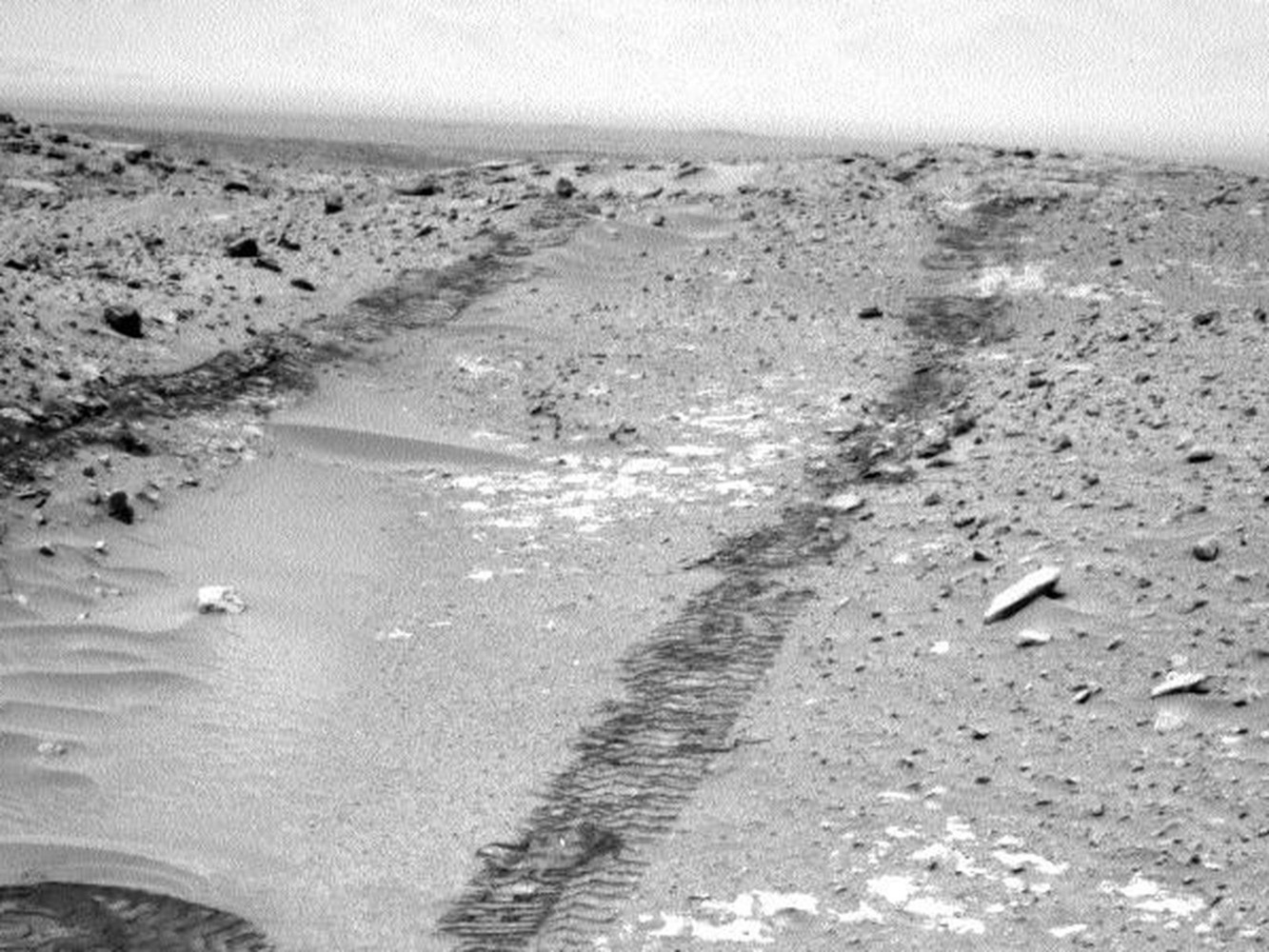 A view of the rover's track marks while steering through a valley on Mars.