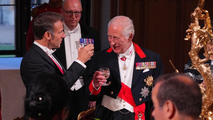 France's President Emmanuel Macron clinks glasses with King Charles III during the State Banquet for President of France Emmanuel Macron and his wife Brigitte Macron, at Windsor Castle on July 8, 2025 in Windsor, England. (Photo by Yui Mok - Pool/Getty Images)