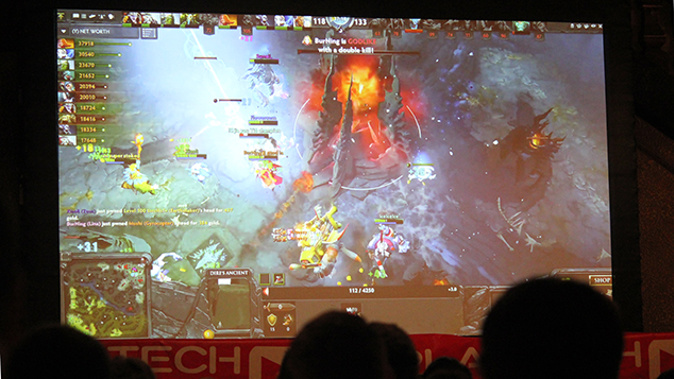 Fans watch the action on screen at the Civic Theatre. (Alex Braae)