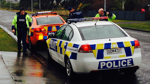 The police who arrested the woman at the Miro St address (Josh Price) 