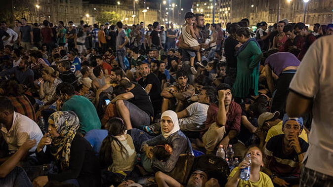 Record numbers of migrants gather in front of Keleti station in Budapest, Hungary.