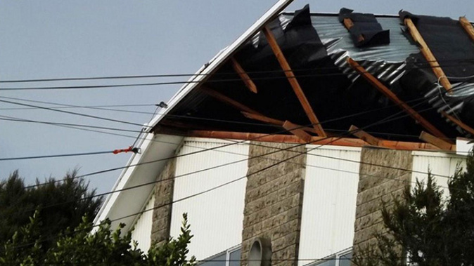 Wild weather caused this roof in Abotsford, Dunedin to lift. (Photo / Adam walker)