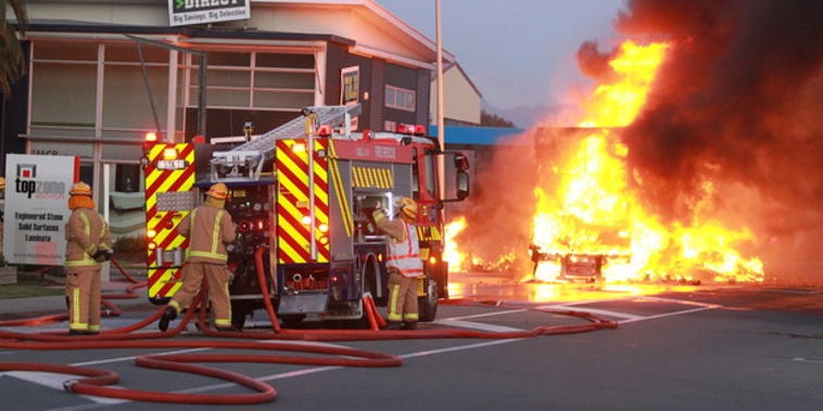 Fire crews battle the blaze after a truck carrying gas cylinders caught fire in Nelson. (NZME./Andrew Board)