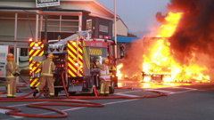 Fire crews battle the blaze after a truck carrying gas cylinders caught fire in Nelson. (NZME./Andrew Board)