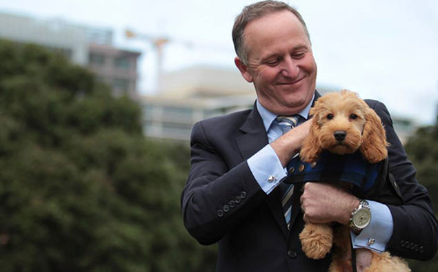 John Key and friendly puppy Bodhi (Twitter)