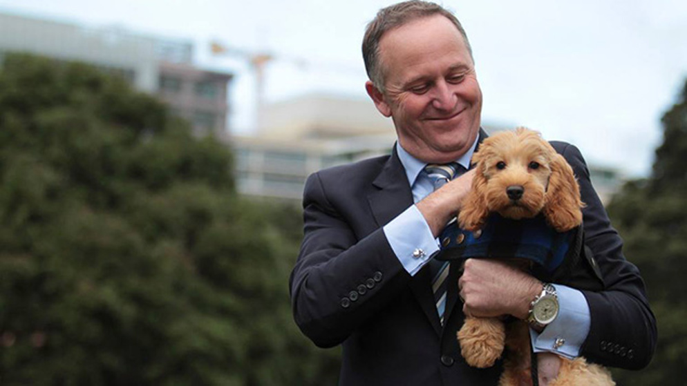 John Key and friendly puppy Bodhi (Twitter)