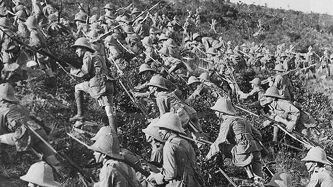 Soldiers charge up a hill in WWI 