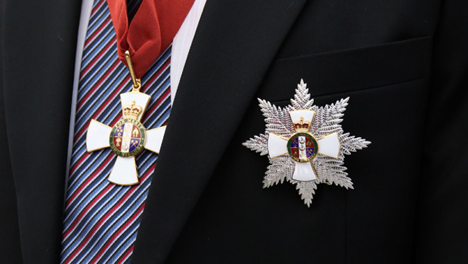 Medals that signify a knighthood and membership in the New Zealand Order of Merit (Getty Images) 