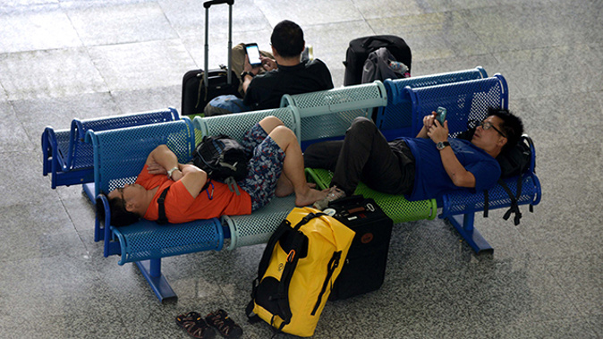 Stranded tourists at Bali airport (Getty).