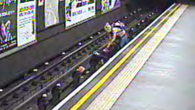 PHOTOS: Child rescued from London tube tracks