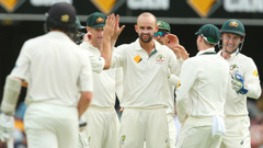 Nathan Lyon congratulated by teammates on taking a wicket. (Getty Images)