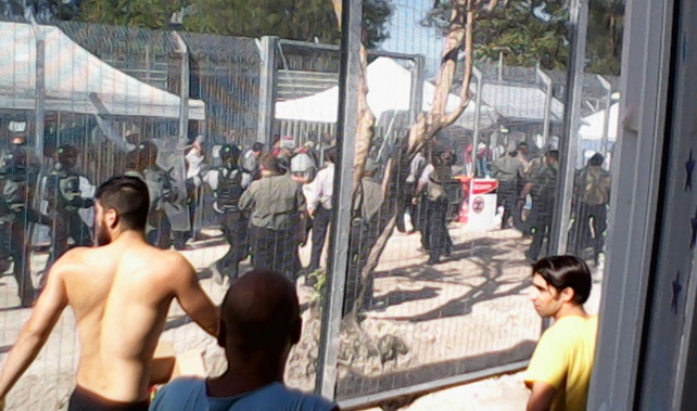 Riot place charge Manus Island detention centre during a hunger strike, January 16, 2015. Around 500 starved themselves while 30 sewed their lips together. 