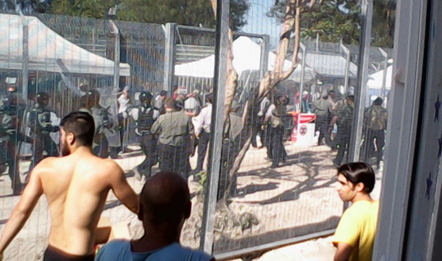 Riot place charge Manus Island detention centre during a hunger strike, January 16, 2015. Around 500 starved themselves while 30 sewed their lips together.