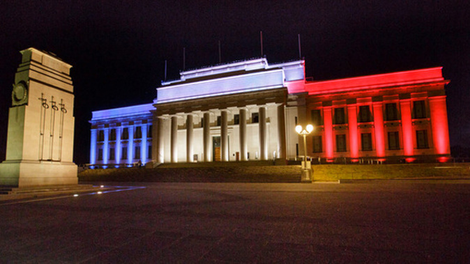 Auckland museum lit up in the French colours of blue, white and red (NZ Herald)