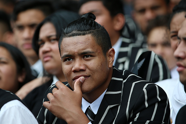 Students from Wesley College look on 