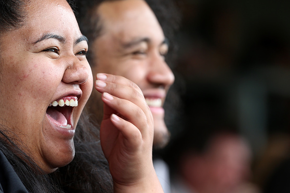 The crowd reacts to Erich Rush's speech 