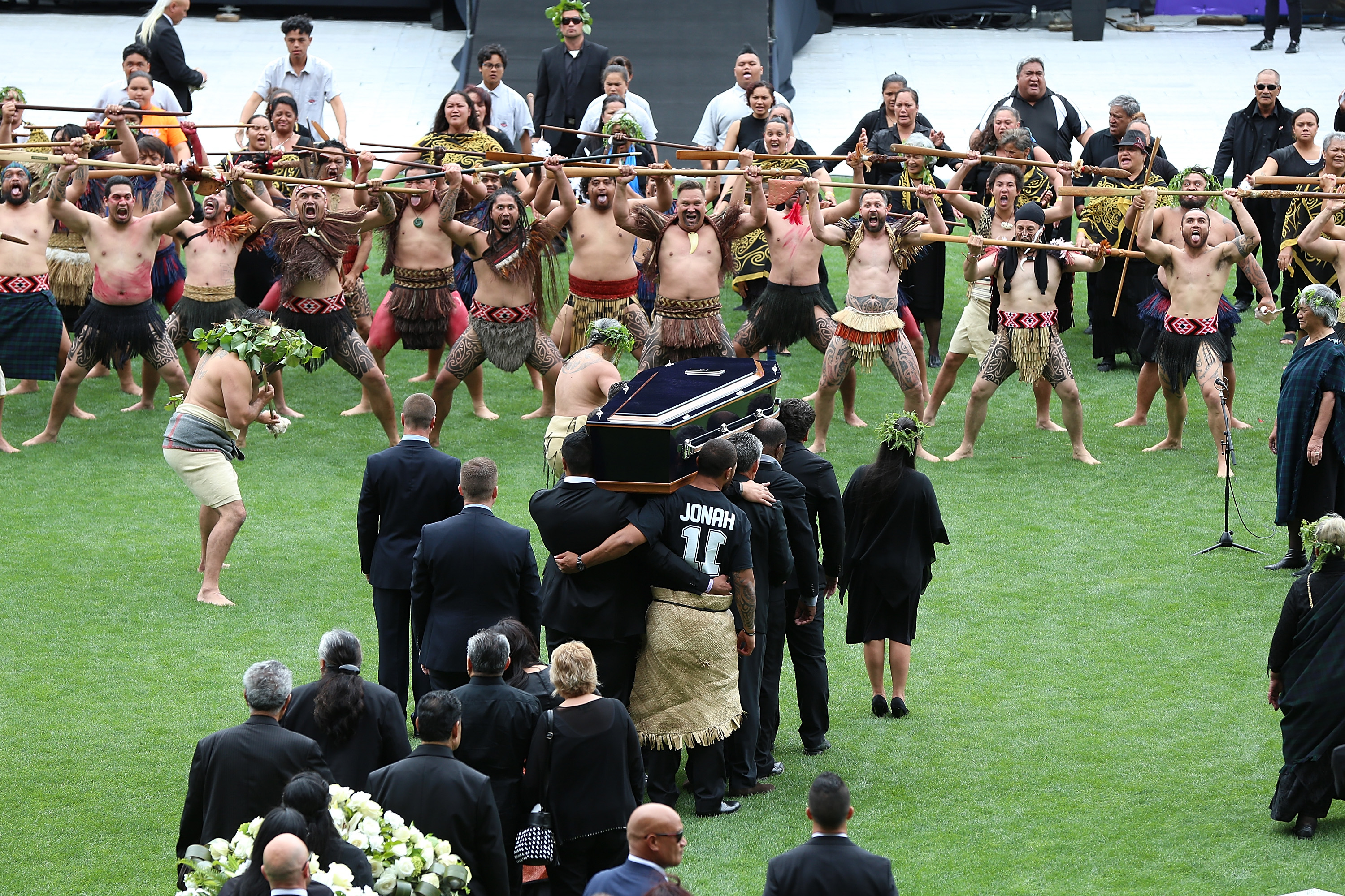 A haka greets Lomu's coffin on the way into Eden Park 