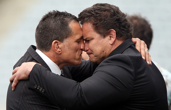 Former All Blacks Dalls Seymour (L) and Michael Jones perform a hongi