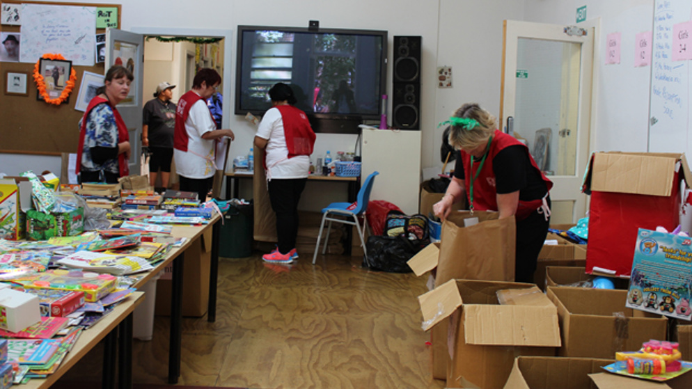 Volunteers packing presents for children.