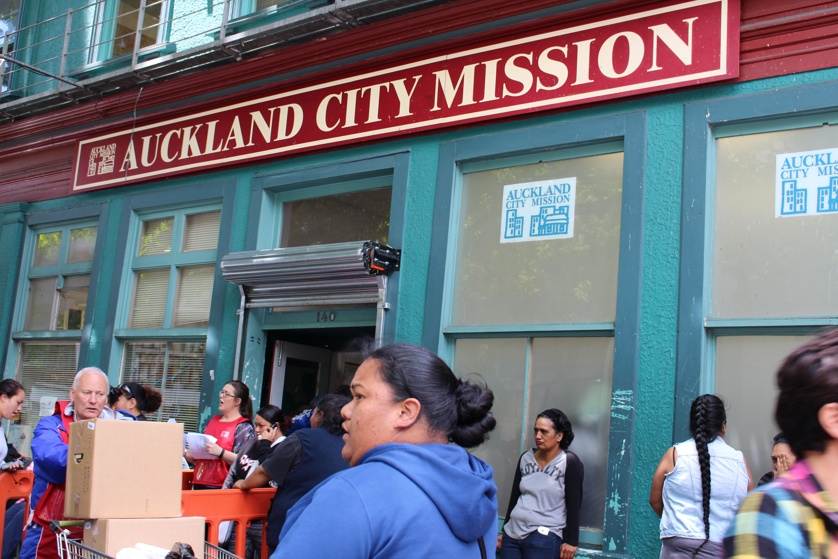 Crowds have gathered outside the City Mission in Auckland for presents and food parcels.  