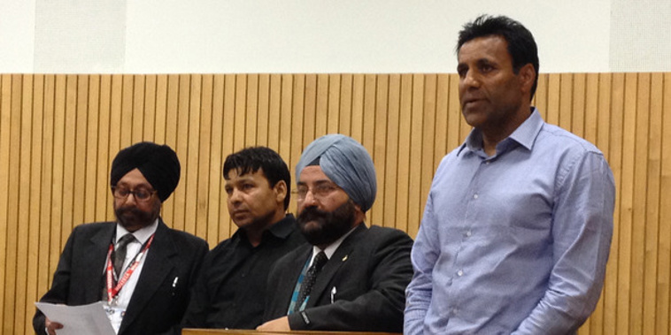 Satnam Singh (2nd from left) and Jaswinder Singh Sangha (right) in Wellington Court. (Photo: John Weekes, NZ Herald)