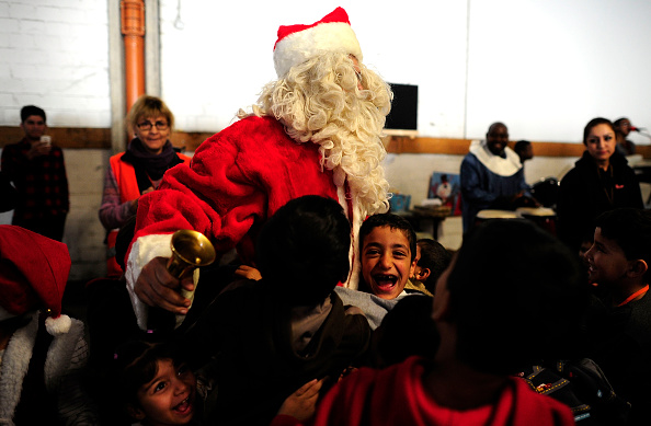 Syrian migrants greeting Santa 