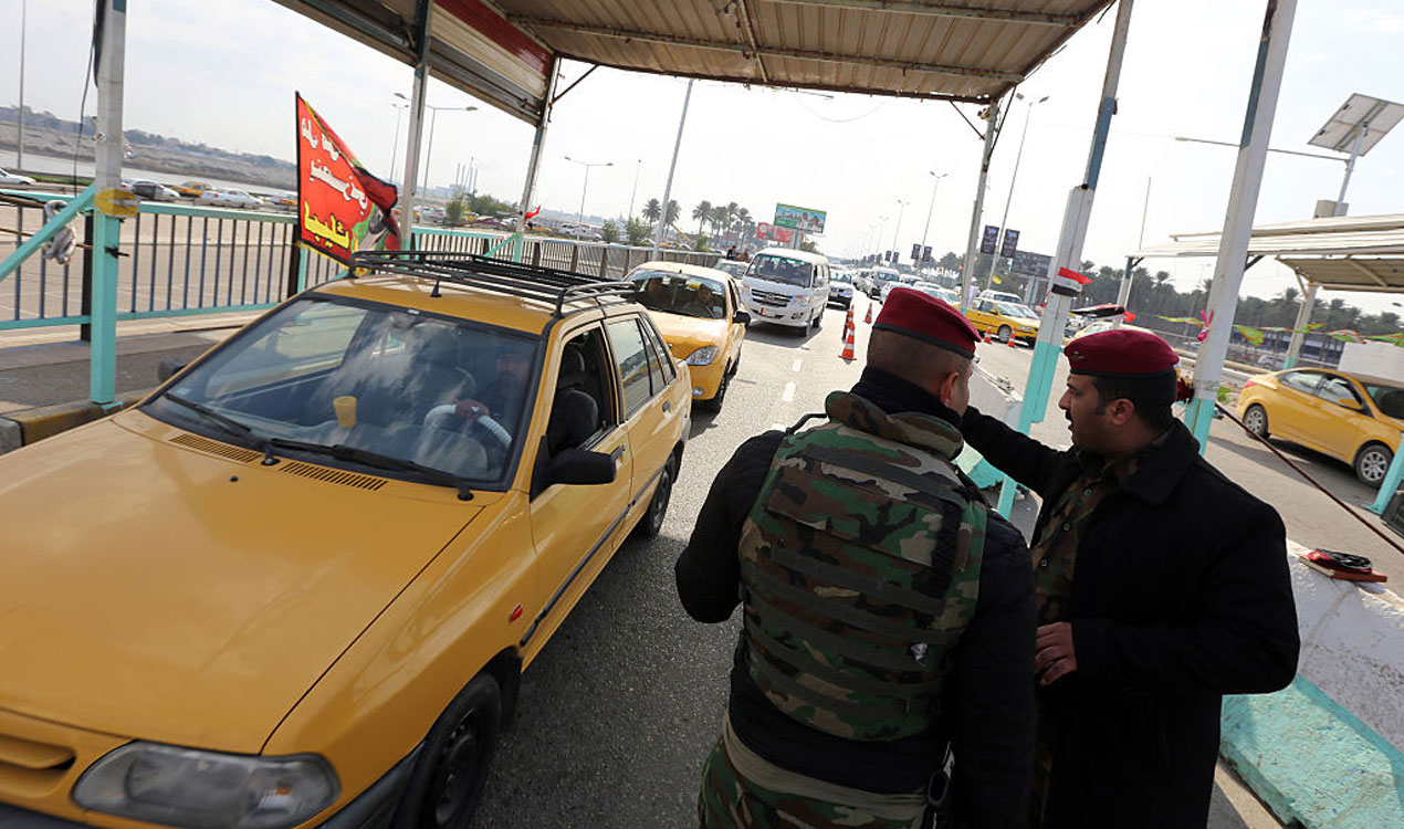 Iraqi police man a checkpoint from Baghdad to Dora (Getty Images) 