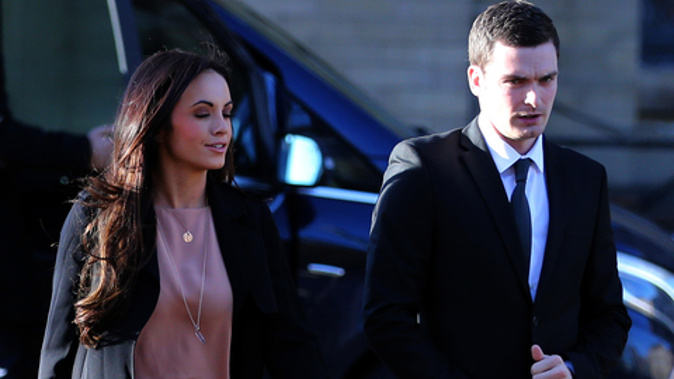 Adam Johnson and his partner Stacey Flounders arrive at court. Photo / Getty Images