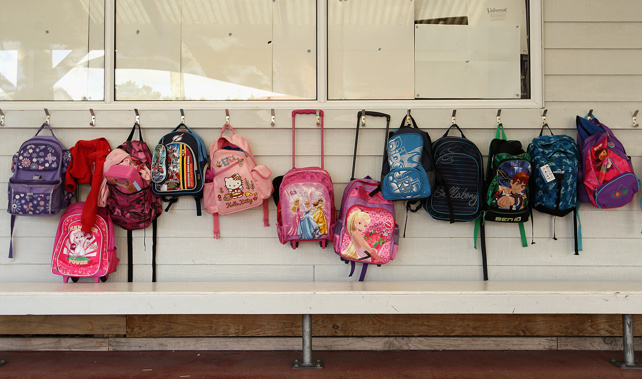 Childrens' schoolbags lined up outside a classroom (Getty Images)