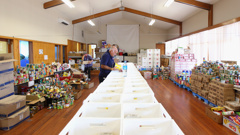 A volunteer sorting through food donations at the Linwood Salvation Army (Getty Images)