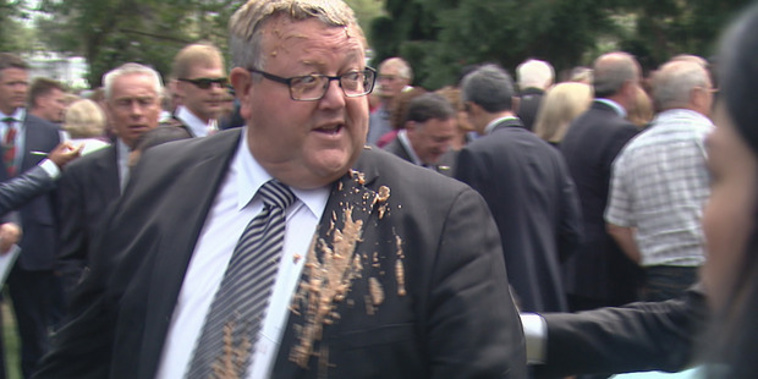 Gerry Brownlee after the muck attack in Christchurch (NZ Herald)
