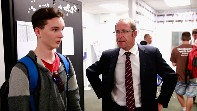 Labour leader Andrew Little speaking to a student at the New Zealand Institute of Information Technology (Getty Images) 