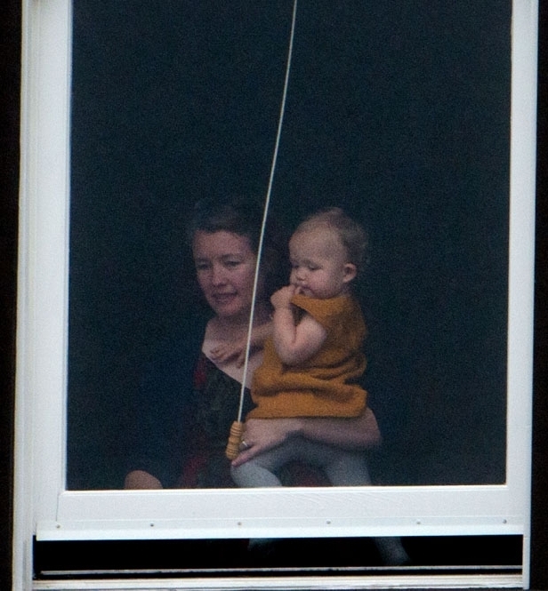 Prince George watched the official welcome from a window at Government House (Getty Images)