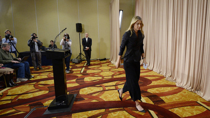 Maria Sharapova leaving the press conference in which she announced she had failed a drug test (Getty Images)