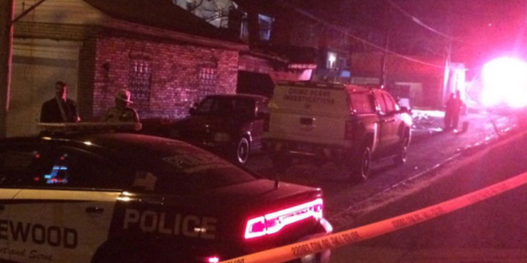 After the shooting, groups of residents gathered on the street, some of them sobbing and saying they lost family members. Photo: WPXI/Twitter