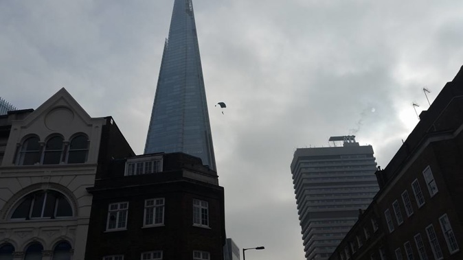 The leaper on his way down after jumping from the 309.6m tower. (Facebook/Brian Travers via Shit London)
