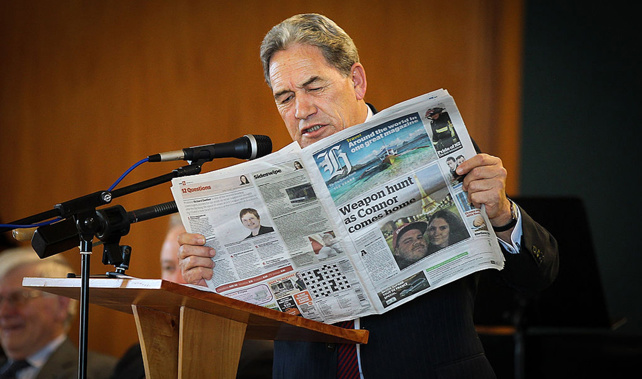 Winston Peters leafs through the New Zealand Herald (Getty Images)