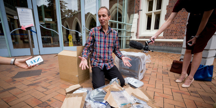 Nicky Hager with his destroyed computer outside Auckland High Court today (NZH).