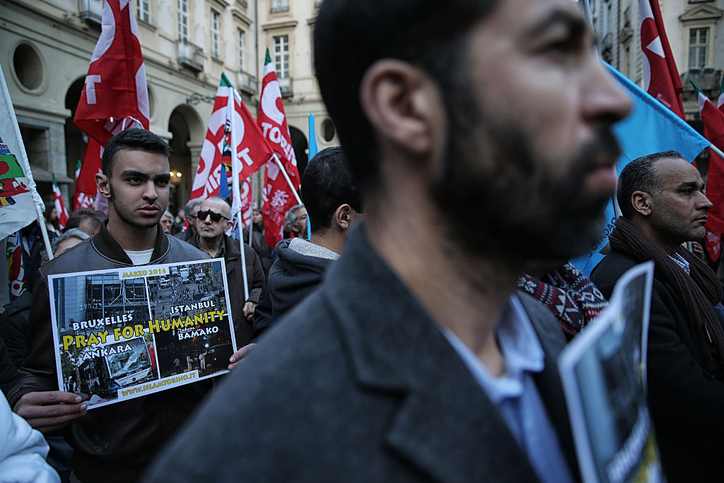 People take part in a rally on the Palazzo di Citta square in Turin, Italy