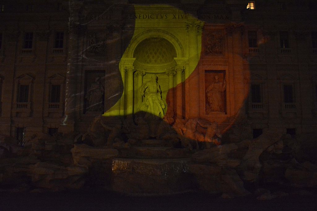 The Trevi Fountain in Rome illuminated with Belgian flag colours 