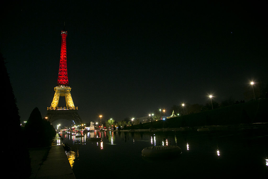 The Eiffel tower is lit up in the colours of the Belgian flag 