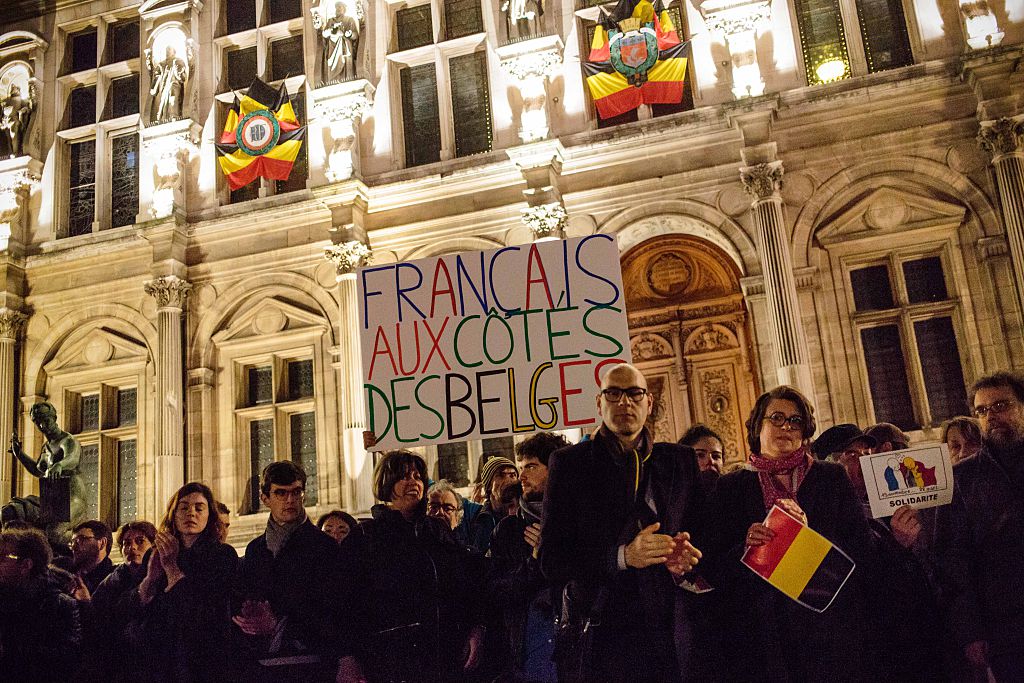 People gather on the front of the Hotel de Ville in Paris
