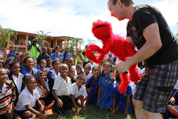 Newstalk ZB's Chris Lynch travelled to Fiji with a couple of quirky companions to entertain cyclone-scared children. (Corinne Ambler/IFRC)