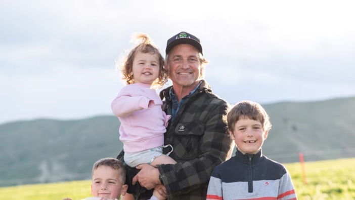 Matt Chisholm with his children Finn, Bree and Bede. Chisholm has written a book about their new life in Omakau, Central Otago. Photo / Lottie Hedley