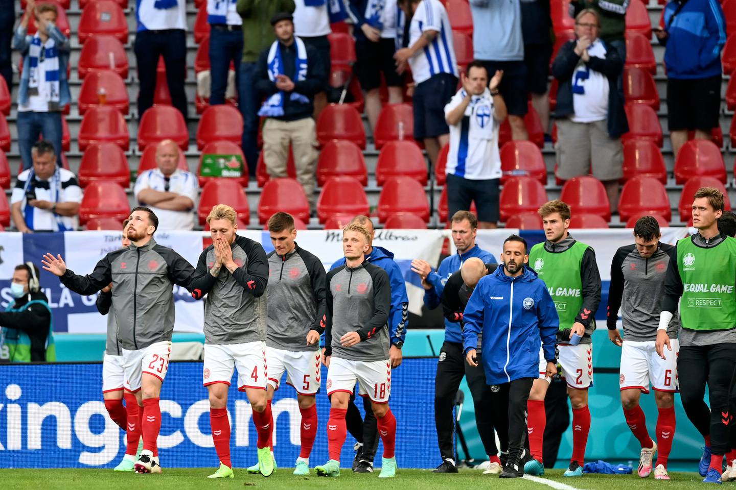 Denmark players return to the pitch to resume the match suspended earlier when Denmark's Christian Eriksen collapsed on the pitch. (Photo / AP)