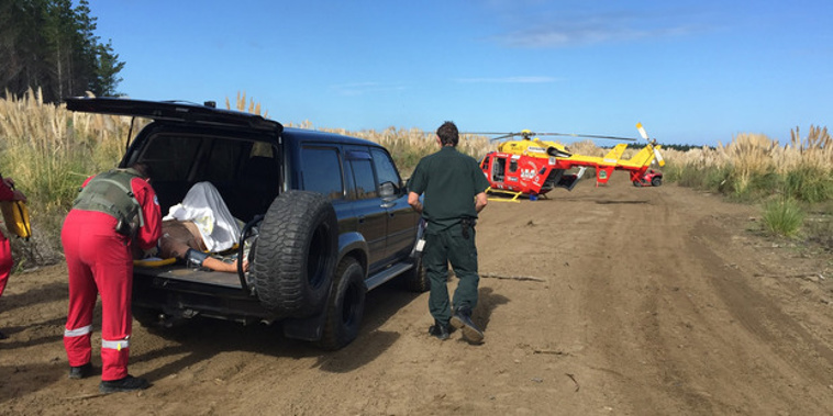 Auckland Westpac rescue helicopter crew attend to a male in his 50's who hit a deer while riding at the Woodhill dirt bike park. (Supplied)