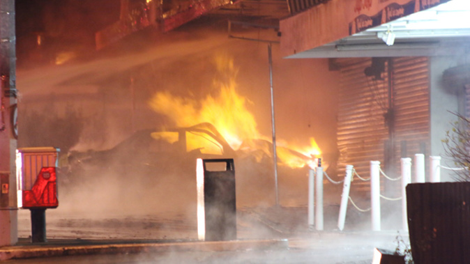 The scene of the gas blast and fire at a block of shops in Papatoetoe this morning (Daniel Hines).