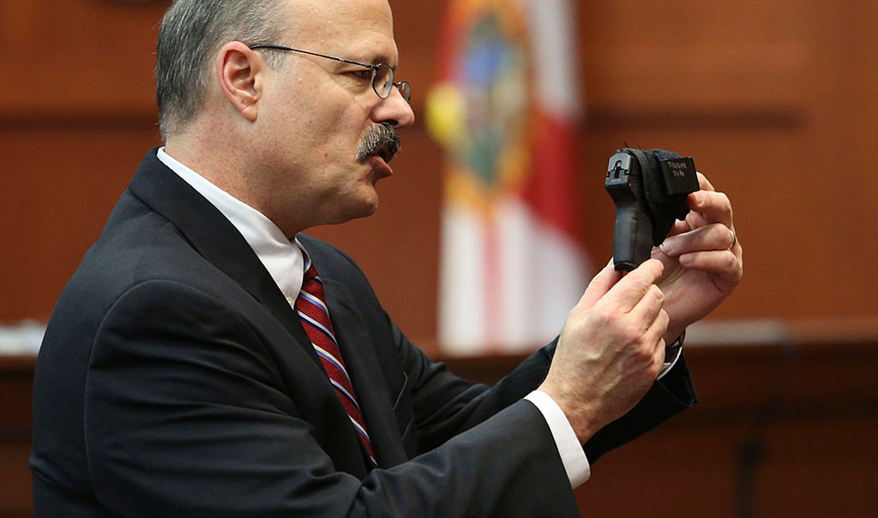 Assistant state attorney shows George Zimmerman's gun to the jury during his trial (Getty Images) 